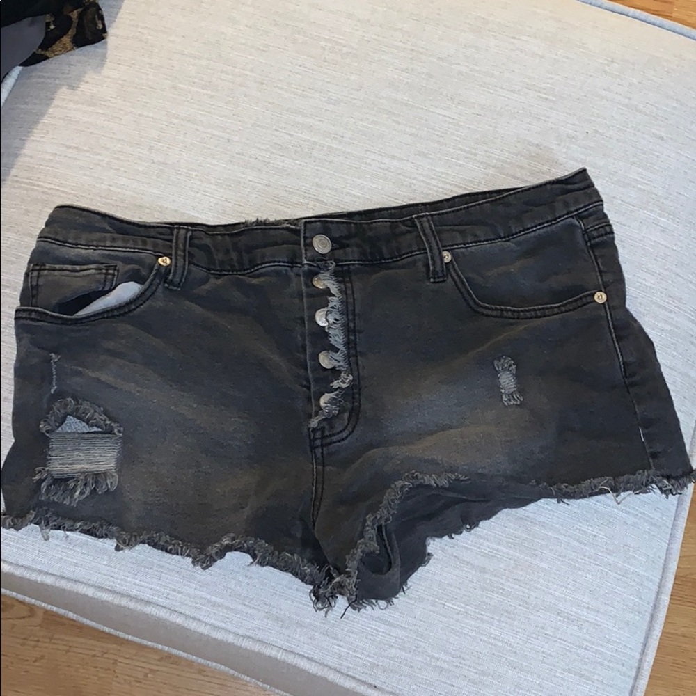 black denim high rise all button shorts.